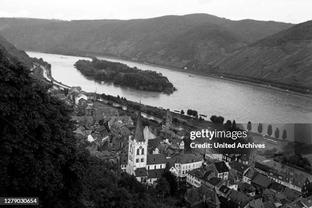 View to the city of Bacharach with the Rhine island Bacharacher Werth, Germany 1968.