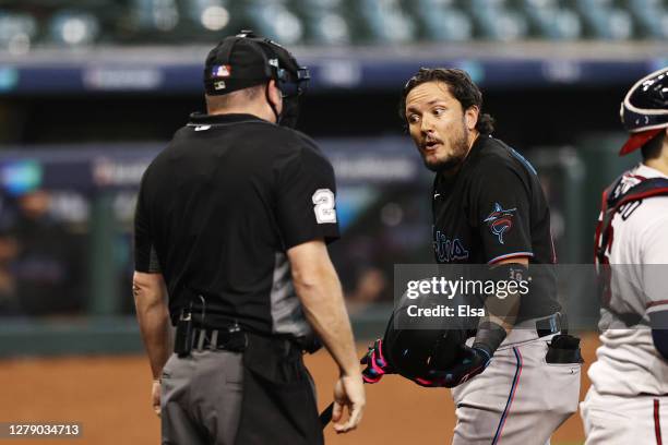 Miguel Rojas of the Miami Marlins reacts after striking out during the seventh inning against the Atlanta Braves in Game Two of the National League...