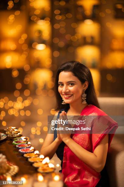 young woman diwali celebrate - stock photo - namaste greeting stock pictures, royalty-free photos & images