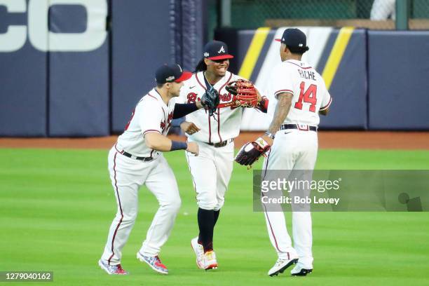 Ronald Acuna Jr. #13, Cristian Pache and Adam Duvall of the Atlanta Braves celebrate their 2 to 0 win over the Miami Marlins in Game Two of the...