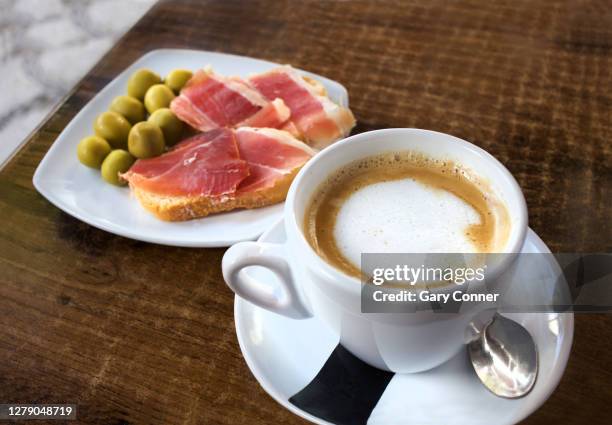 cafe con leche and tapas in spain - cafe con leche stock-fotos und bilder