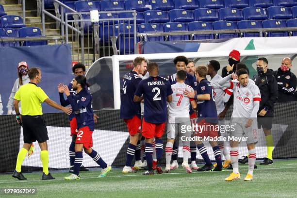 Members of the New England Revolution and Toronto FC fight during the first half of their match at Gillette Stadium on October 07, 2020 in...
