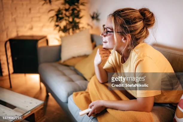 i love this show - woman watching tv stock pictures, royalty-free photos & images