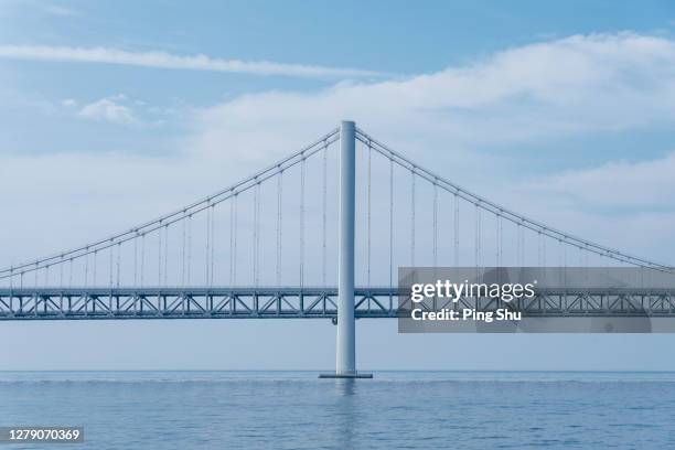 suspension bridges on the sea - puente colgante fotografías e imágenes de stock