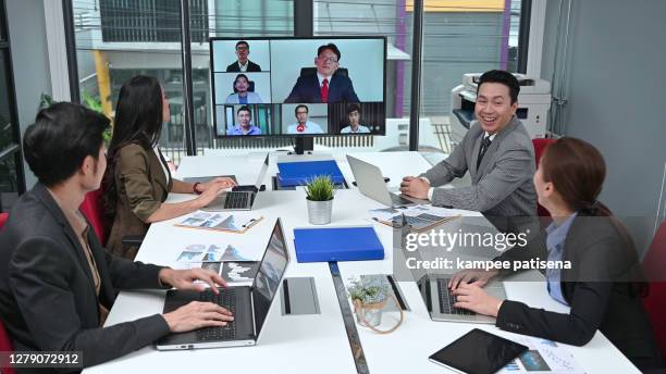 business boardroom meeting with split-screen video conference call. - split screen ストックフォトと画像