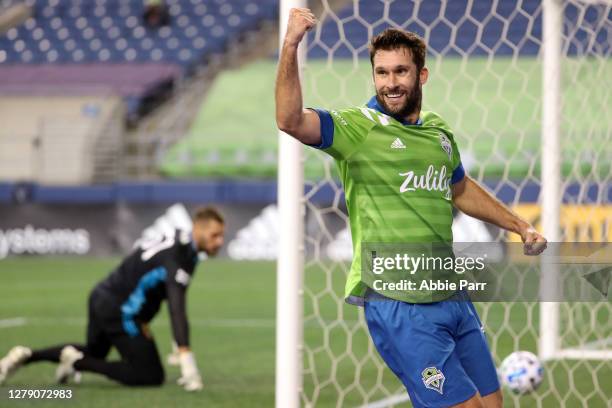 Will Bruin celebrates his assist to Jordan Morris of Seattle Sounders to score a goal in the first half against Andrew Putna of Real Salt Lake and...