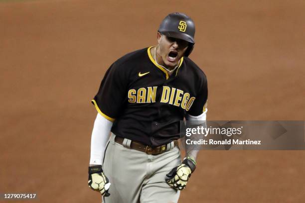 Manny Machado of the San Diego Padres reacts as he runs the bases after hitting a solo home run during the sixth inning against the Los Angeles...