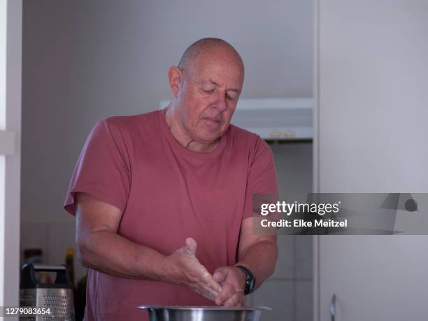 senior making a cake - mixing bowl stock pictures, royalty-free photos & images