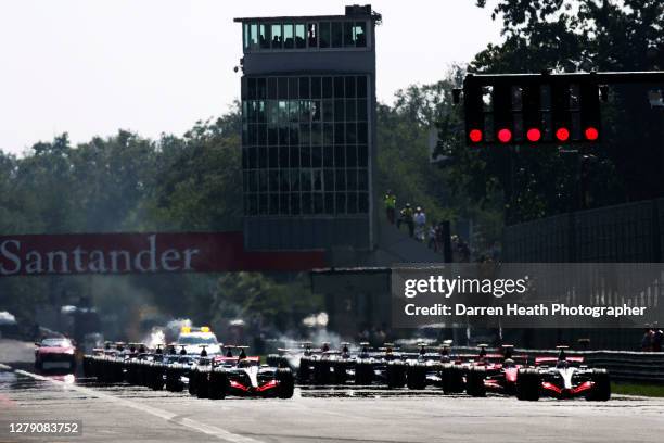 Spanish McLaren Formula One driver Fernando Alonso sits on pole position alongside his British teammate Lewis Hamilton in their McLaren MP4-22 cars...