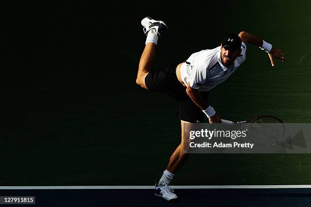 Christopher Kas of Germany serves during his first round doubles match against Tatsuma Ito and Kei Nishikori of Japan during day one of the Rakuten...