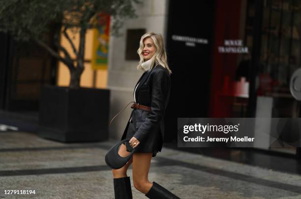 Xenia Adonts seen wearing a complete Miu Miu look outside Miu Miu during Paris Fashion Week - Womenswear Spring Summer 2021 : Day Nine on October 06,...