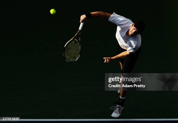 Alexander Peya of Austria serves during his first round doubles match against Tatsuma Ito and Kei Nishikori of Japan during day one of the Rakuten...