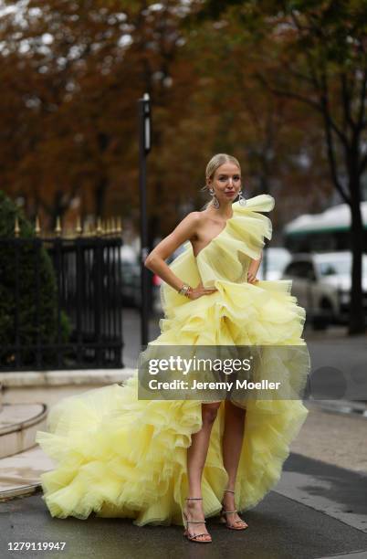 Leonie Hanne seen wearing a yellow Georges Hobeika dress and Chanel earrings during Paris Fashion Week - Womenswear Spring Summer 2021 : Day Nine on...