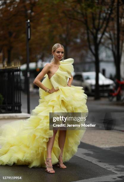 Leonie Hanne seen wearing a yellow Georges Hobeika dress and Chanel earrings during Paris Fashion Week - Womenswear Spring Summer 2021 : Day Nine on...