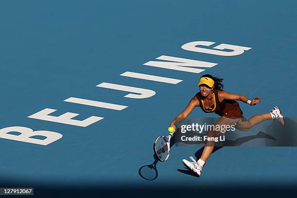 Jie Zheng of China returns a shot to Alberta Brianti of Italy during day three of the China Open at the National Tennis Center on October 3, 2011 in...