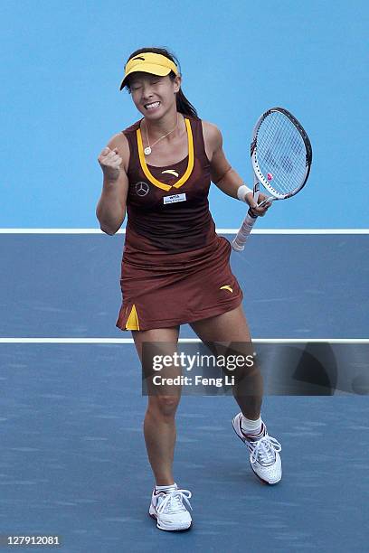 Jie Zheng of China celebrates winning against Alberta Brianti of Italy during day three of the China Open at the National Tennis Center on October 3,...