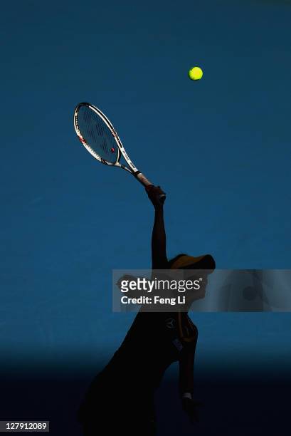 Jie Zheng of China serves a shot to Alberta Brianti of Italy during day three of the China Open at the National Tennis Center on October 3, 2011 in...