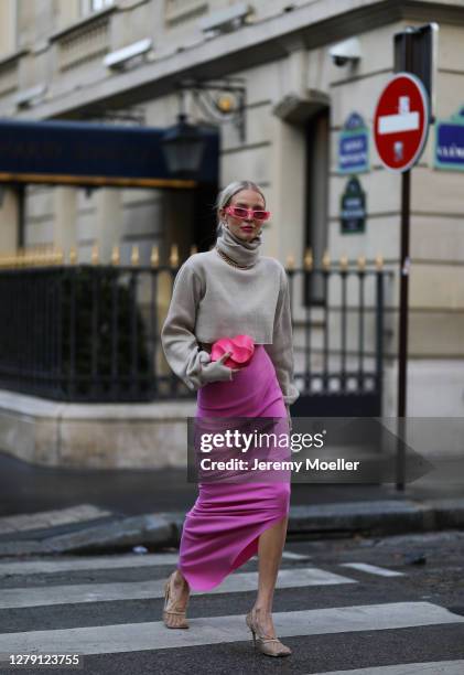 Leonie Hanne seen wearing a Gucci shades, Bottega Veneta bag and heels, purple skirt during Paris Fashion Week - Womenswear Spring Summer 2021 : Day...