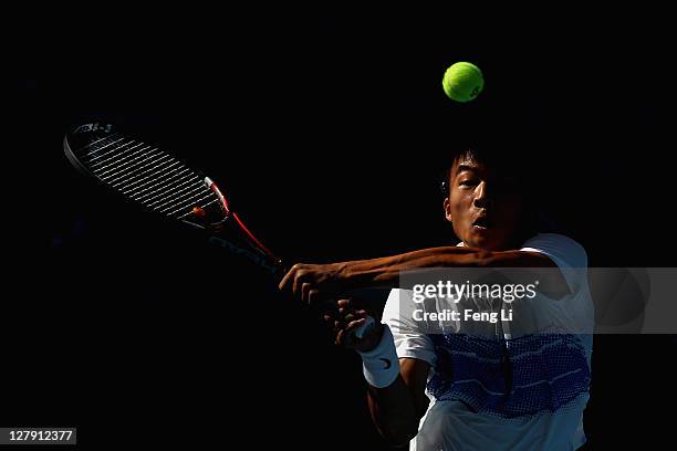 Di Wu of China returns a shot to Marin Cilic of Croatia during day three of the China Open at the National Tennis Center on October 3, 2011 in...