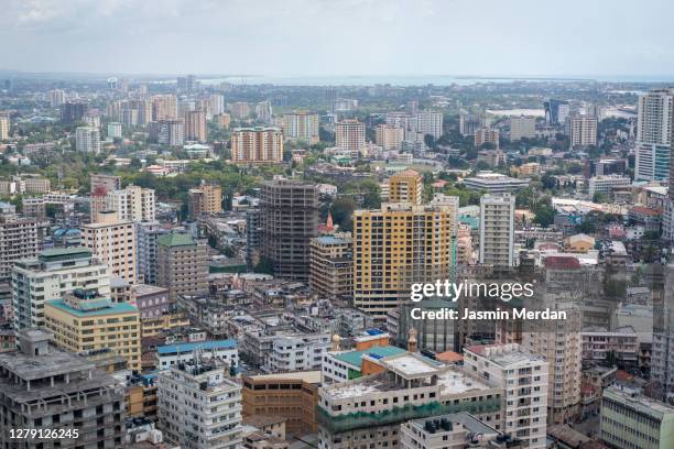 dar es salaam business district cityscape high angle view with coastline - dar es salaam stock-fotos und bilder