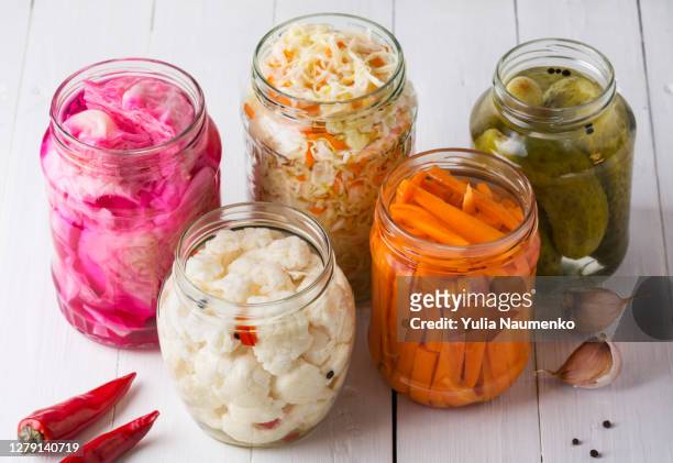 fermented vegetables. sauerkraut with carrots and cucumbers. - pickle jar imagens e fotografias de stock
