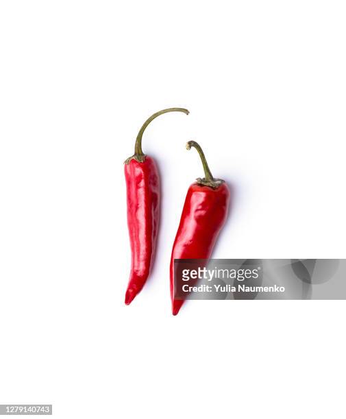 wilted chili pepper. white background. - chilis stockfoto's en -beelden
