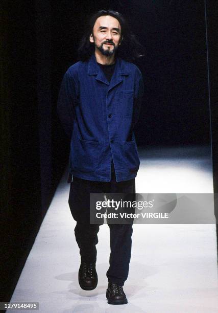 Fashion designer Yohji Yamamoto walks the runway during the Yohji Yamamoto Ready to Wear Fall/Winter 1998-1999 fashion show as part of the Paris...