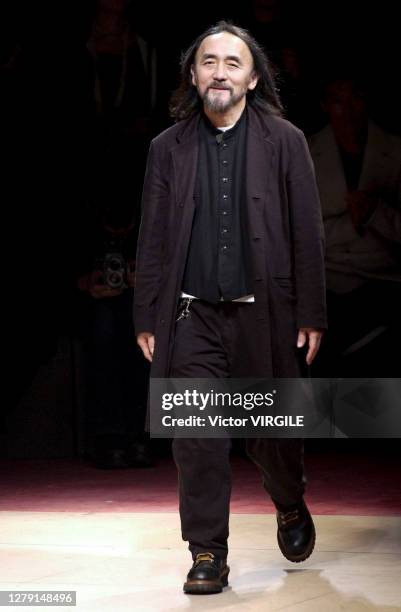 Fashion designer Yohji Yamamoto walks the runway during the Yohji Yamamoto Menswear Fall/Winter 2003-2004 fashion show as part of the Paris Menswear...