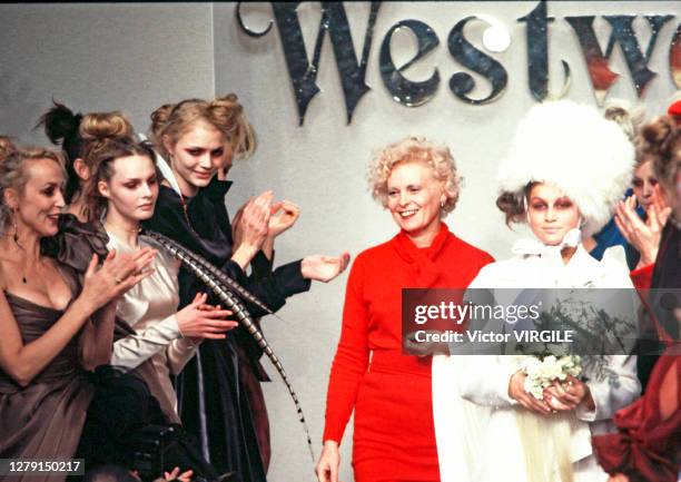 Fashion designer Vivienne Westwood and model Laetitia Casta walk the runway during the Vivienne Westwood Ready to Wear Fall/Winter 1996-1997 fashion...