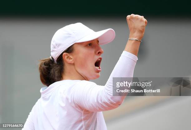 Iga Swiatek of Poland celebrates after winning a point during her Women's Singles semifinals match against Nadia Podoroska of Argentina on day twelve...