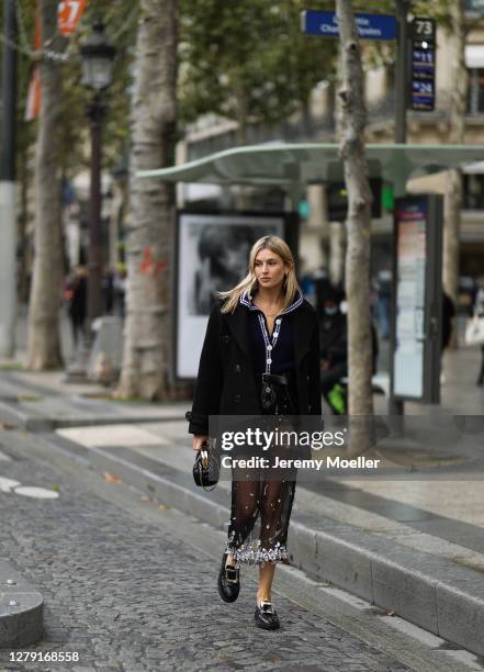 Camille Charriere seen wearing a complete Miu Miu look outside Miu Miu during Paris Fashion Week - Womenswear Spring Summer 2021 : Day Nine on...