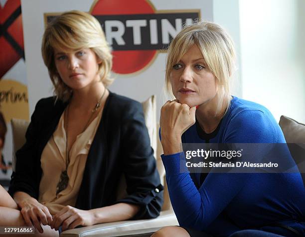Actresses Liz Solari and Natasha Stefanenko attend "Ex - Amici Come Prima" Photocall at Terrazza Martini on October 3, 2011 in Milan, Italy.