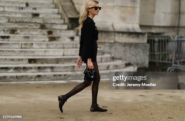 Camille Charriere seen wearing a complete Chanel look outside Chanel during Paris Fashion Week - Womenswear Spring Summer 2021 : Day Nine on October...