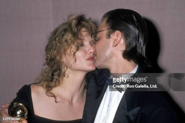 Actress Michelle Pfeiffer and actor Fisher Stevens attend the 47th Annual Golden Globe Awards on January 20, 1990 at Beverly Hilton Hotel in Beverly...