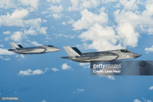 Two F-35B combat aircraft from the Royal Air Force prepare to refuel from an RAF Voyager aircraft over the North Sea on October 08, 2020 in flight,...