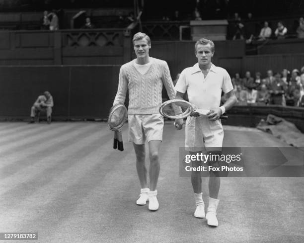 Lennart Bergelin of Sweden and Art Larsen of the United States walk on to Centre Court before their Men's Singles Second Round match at the Wimbledon...