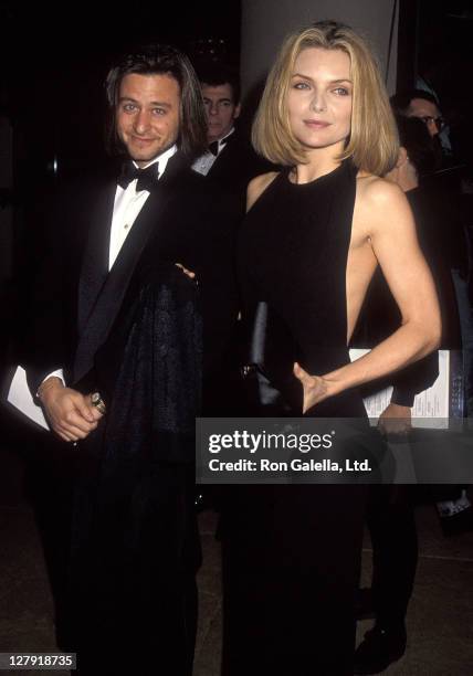 Actor Fisher Stevens and actress Michelle Pfeiffer attend the 49th Annual Golden Globe Awards on January 18, 1992 at Beverly Hilton Hotel in Beverly...