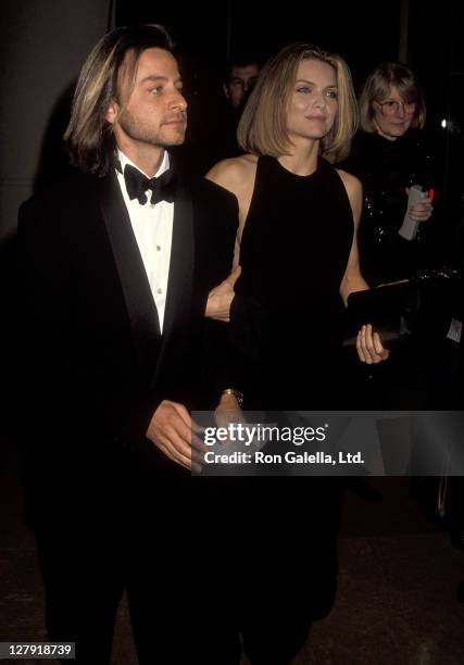 Actor Fisher Stevens and actress Michelle Pfeiffer attend the 49th Annual Golden Globe Awards on January 18, 1992 at Beverly Hilton Hotel in Beverly...