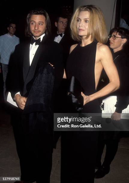 Actor Fisher Stevens and actress Michelle Pfeiffer attend the 49th Annual Golden Globe Awards on January 18, 1992 at Beverly Hilton Hotel in Beverly...