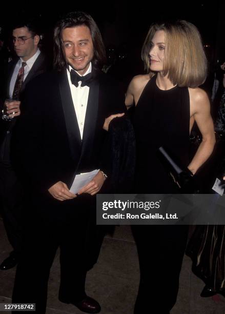Actor Fisher Stevens and actress Michelle Pfeiffer attend the 49th Annual Golden Globe Awards on January 18, 1992 at Beverly Hilton Hotel in Beverly...