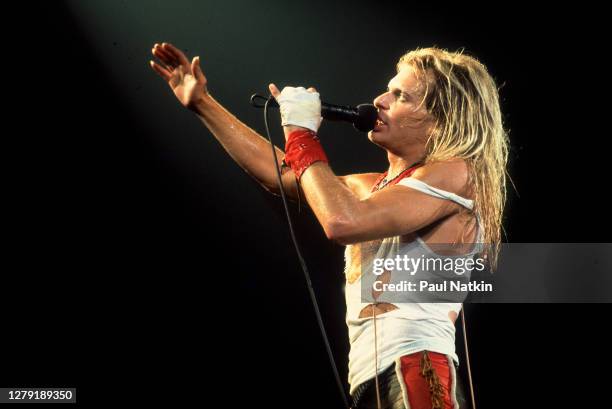 American Rock musician David Lee Roth, of the group Van Halen, performs onstage at the International Amphitheater, Chicago, Illinois, October 11,...