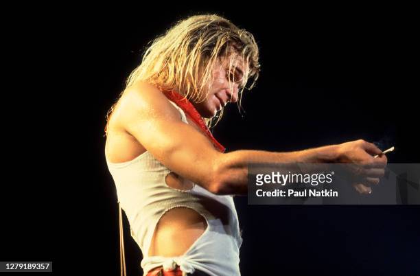 American Rock musician David Lee Roth, of the group Van Halen, performs onstage at the International Amphitheater, Chicago, Illinois, October 11,...
