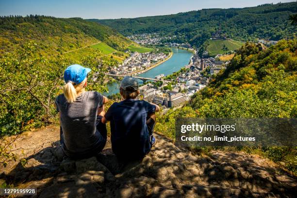 mother and son looking down to cochem and river mosel in germany - mosel valley stock pictures, royalty-free photos & images