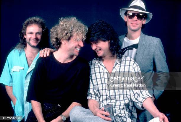 Portrait of Rock musicians Michael Anthony, Sammy Hagar, Eddie Van Halen , and Alex Van Halen, all of the group Van Halen, backstage at the Metro...