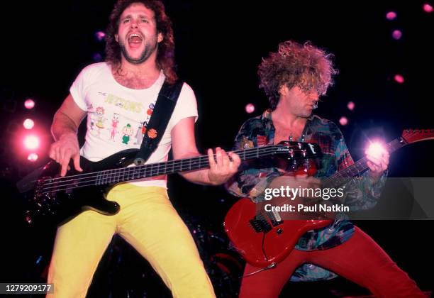 Rock musicians Michael Anthony and Sammy Hagar, both of the group Van Halen, perform onstage at the Metro Center, Rockford, Illinois, March 16, 1986.