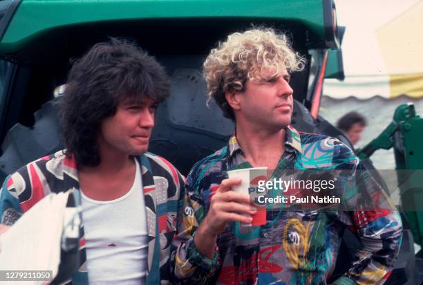Rock musicians Eddie Van Halen and Sammy Hagar, both of the group Van Halen, backstage at Veteran's Stadium for the first Farm Aid benefit concert,...