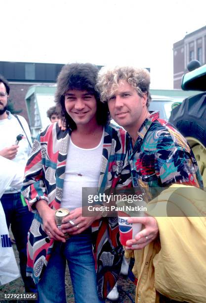 Rock musicians Eddie Van Halen and Sammy Hagar, both of the group Van Halen, backstage at Veteran's Stadium for the first Farm Aid benefit concert,...