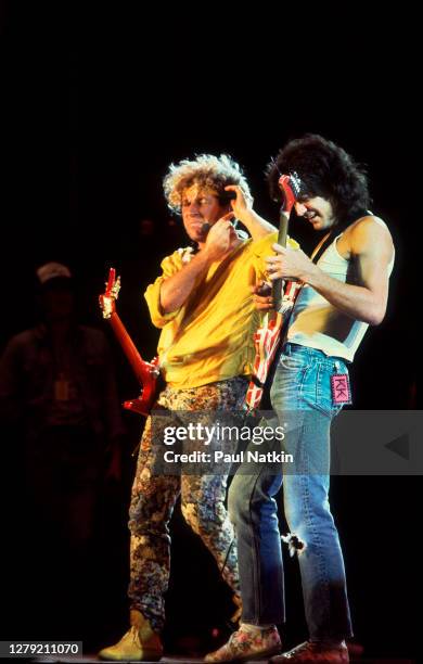 Rock musicians Eddie Van Halen and Sammy Hagar, both of the group Van Halen, perform onstage at Veteran's Stadium for the first Farm Aid benefit...