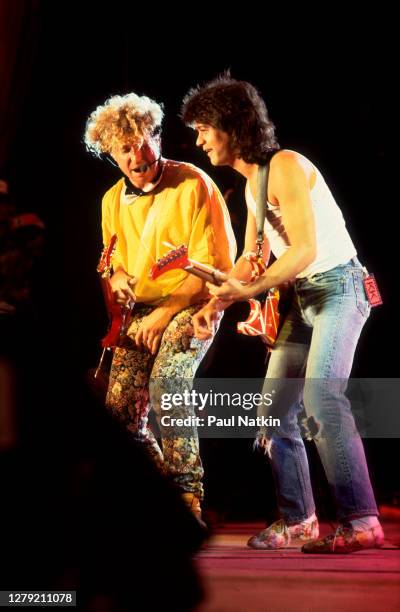 Rock musicians Eddie Van Halen and Sammy Hagar, both of the group Van Halen, perform onstage at Veteran's Stadium for the first Farm Aid benefit...