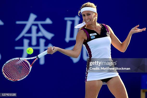 Gisela Dulko of Argentina returns a shot to Virginie Razzano of France during the China Open at the National Tennis Center on October 3, 2011 in...